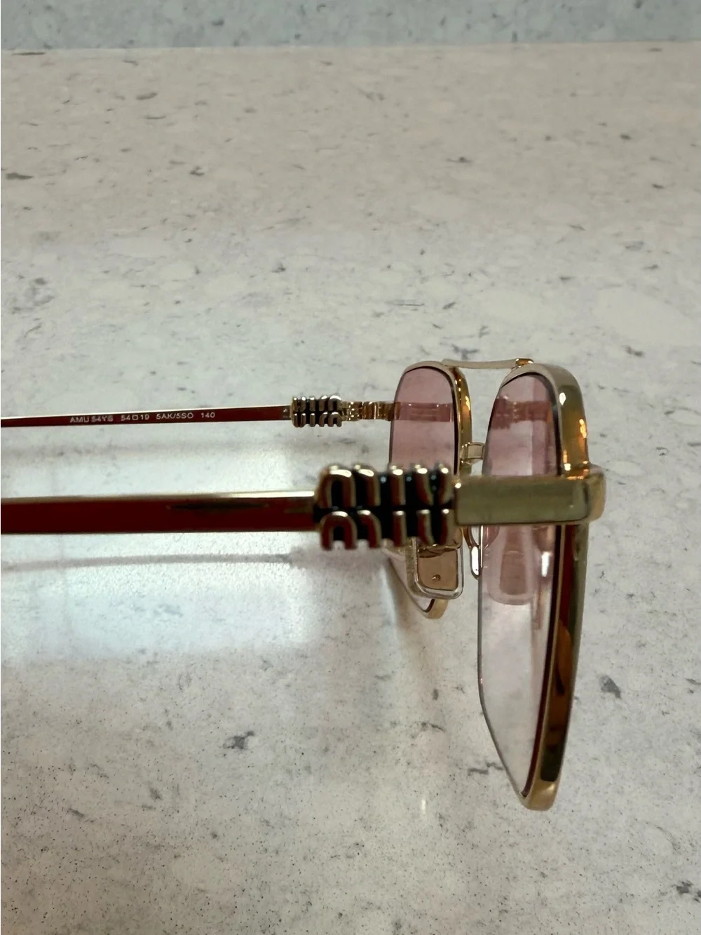 Miu Miu Gold Frame Sunglasses with Pink Gradient Lenses